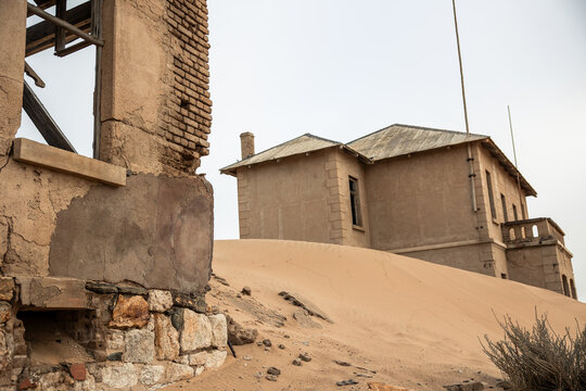 Kolmanskop ghost town ruins overtaken by desert sand
