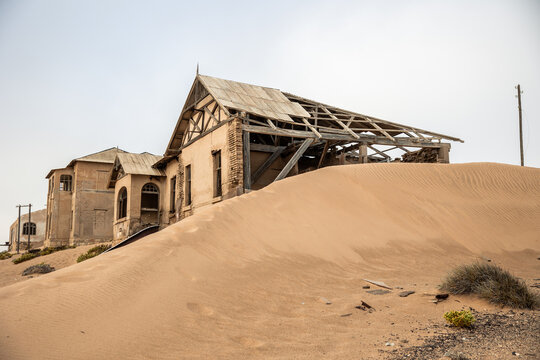 Kolmanskop ghost town ruins with sand filling abandoned buildings in Namibia