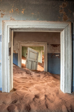 vertical Kolmanskop ghost town room filling with sand