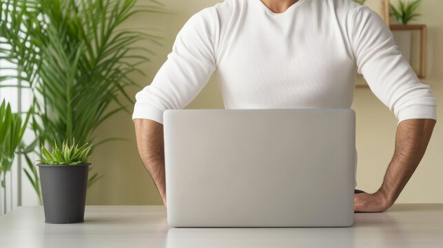 Connected Professional Task Session: Remote Worker Stretching Beside Laptop At Home Working Remote