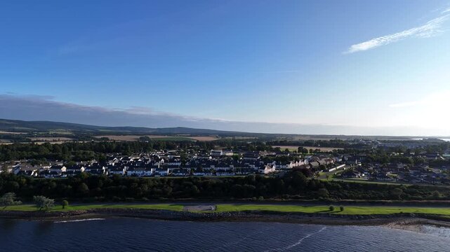 Wide angle aerial drone view of the coastal town of Invergordon along the Cromarty Firth, Ross and Cromarty, Scottish Highlands, Scotland, UK