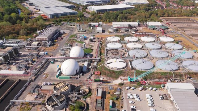 An aerial drone forward push in movement towards the construction of anaerobic digesters at a large scale waste water treatment plant in Minworth, UK
