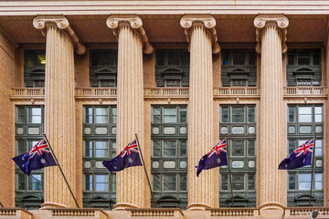 Fototapeta premium Sydney building facade with Australian flags and Ionic columns