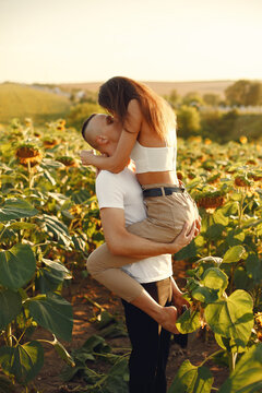 People spend time in a sunflowers field