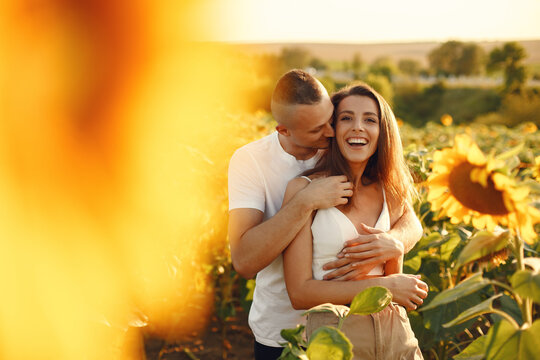 People spend time in a sunflowers field