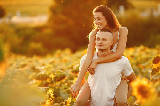 People spend time in a sunflowers field