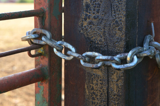 old rusty gate with chains 