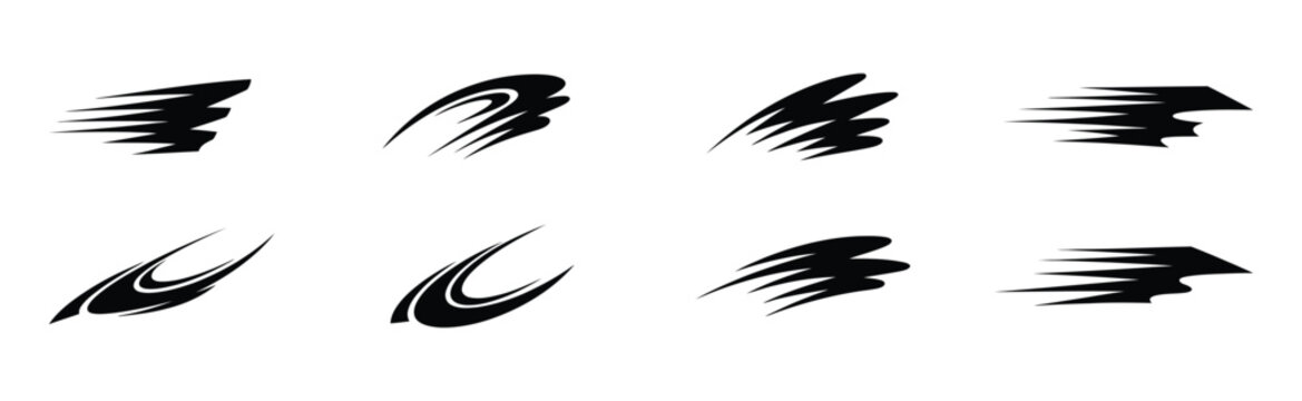 Set of black ink brush strokes and motion blur marks isolated on a white background