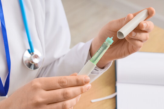 Female doctor with hormone injection in clinic, closeup