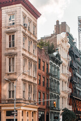 Fototapeta premium Street perspective of architecture in Tribeca Manhattan, New York City. SoHo, Chinatown, Financial District, Little Italy, Nolita