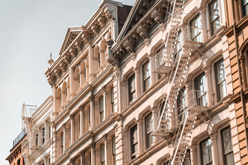 Fototapeta premium Street perspective of architecture in Tribeca Manhattan, New York City. SoHo, Chinatown, Financial District, Little Italy, Nolita