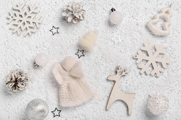 Fototapeta premium Composition with decorative snow, Christmas balls and decor on white background, closeup
