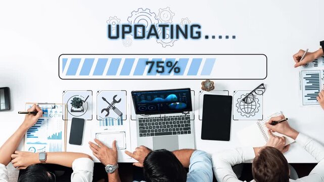 Team Collaboration on Project Update with Progress Bar and Data Visualization Elements on a Modern Desk Sigmoid