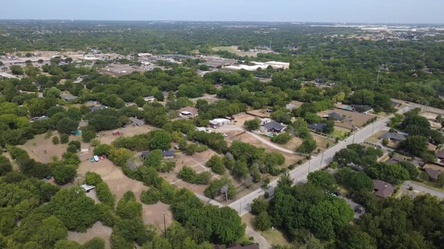 Linear neighborhood roadways cut through established Meadowbrook estates near Ten Mile Creek. Custom homes, private swimming pools feature extensive shaded lawn plots, DeSoto, Texas