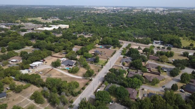 Acreage homesteads, workshop outbuildings border quiet country lanes near Polk Street. Spacious rural parcels display private swimming pools, unpaved parking driveways, DeSoto, Texas