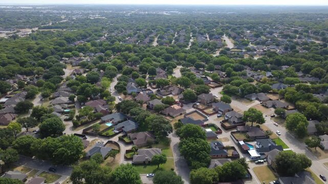 Linear arterial corridors extend directly toward distant municipal water storage towers. Contrasting acreage properties, dense residential tracts border paved thoroughfares, DeSoto, Texas