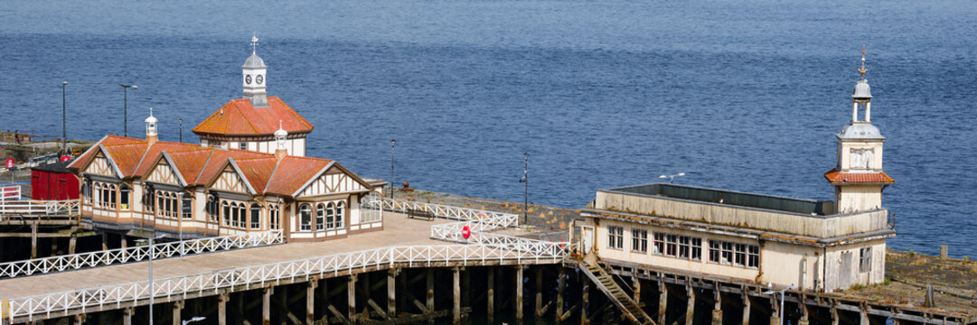 Dunoon victorian pier, derelict wooden structure and buildings