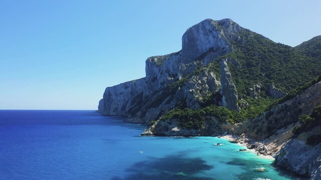 Stunning aerial footage of Cala Goloritze beach, located near Baunei in Sardinia, Italy.