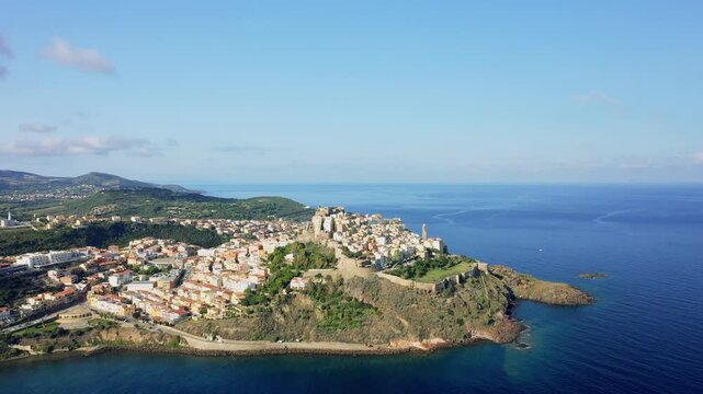 Aerial footage showcasing the historic center of Castelsardo, a picturesque coastal town in northern Sardinia, Italy. No people are visible in the footage.