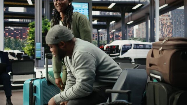 Couple embrace tightly in a bus terminal before departure during an emotional goodbye, sharing a final hug before a long-distance trip separates the travelers and ends their time together.