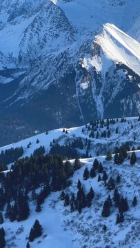Vertical 9:16 video showing a panoramic view of the Massif du Mont Blanc in the French Alps. No people or man-made structures are visible in the frame.