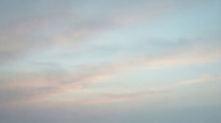 Fototapeta premium Sky shows soft clouds with shades of pink and blue as day begins to break. The scene captures the early morning light gently illuminating the horizon.