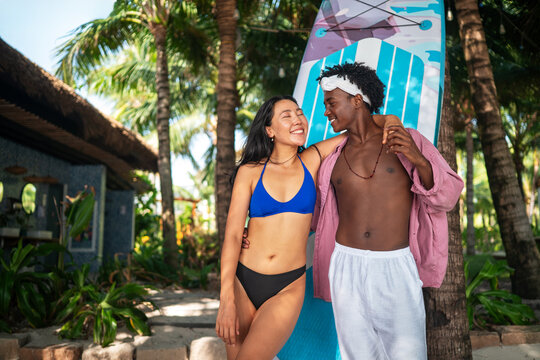 Romantic young couple enjoying their tropical honeymoon on a beautiful sunny beach
