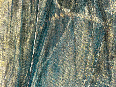 Textured close-up of traditional Arte Xavega fishing nets