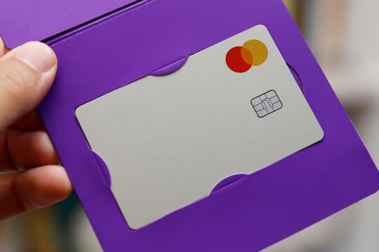 Mastercard logo on credit card. Digital payment system.