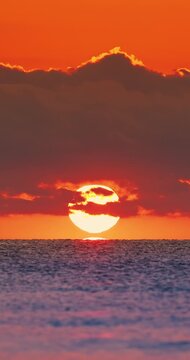 Golden Sunrise Over Ocean Horizon With Dramatic Clouds And Sunlight Reflection on the ripple water video