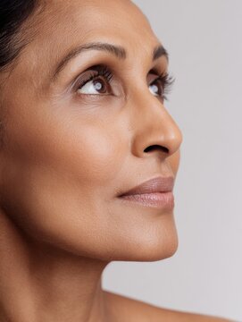 Close-up profile portrait of a mature adult looking upward