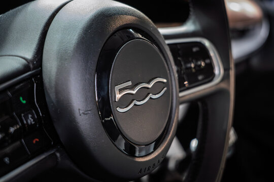 BELGRADE, SERBIA - MARCH 22, 2026: Close-up of the Fiat 500 logo on a steering wheel in Belgrade, Produced by Stellantis, Fiat 500 is an italian micro car and hatchback.