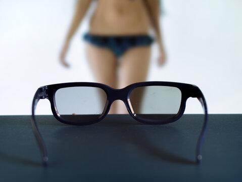 Stylish Sunglasses in Focus with Model Background