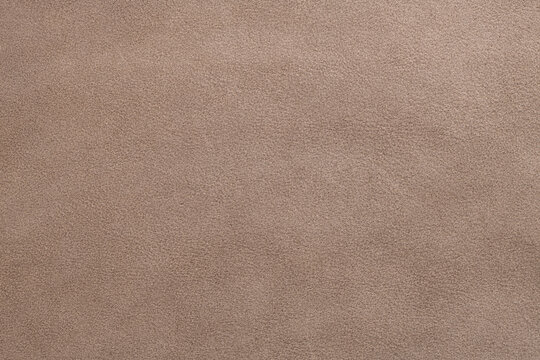 Close up of brown suede or nubuck leather texture background