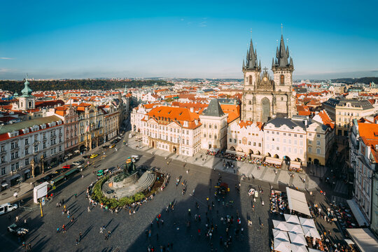 Wide aerial view of the bustling Old Town Square in Prague.