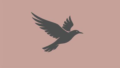 Obraz premium Dark grey silhouette of a flying bird in mid-air with outstretched wings on a dusty rose pink background.