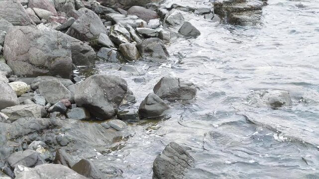 waves crashing against rocks 