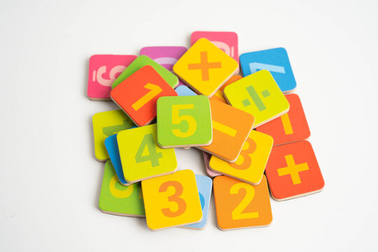 Number wood block cubes for learning Mathematic, education math concept.