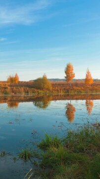 Autumn lakeside landscape with colorful trees and reflections