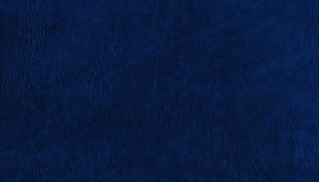 Dark blue wrinkled texture with a leather-like surface and subtle creases. Abstract deep blue background ideal for design, decoration and graphic compositions.