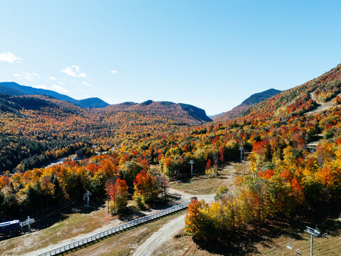 Fall Colours in the White Face Mountain ski resort and lake. Color Change, Vermont, USA.