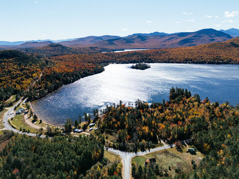 Fall Colours in the White Face Mountain ski resort and lake. Color Change, Vermont, USA.