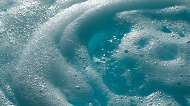 Abstract foam texture with light blue hue surface close up video