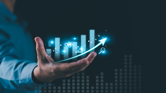 A financial analyst evaluates revenue growth, profit performance, market trends, investment strategy, data analytics, financial forecasting, productivity, and economic growth for strategic planning.
