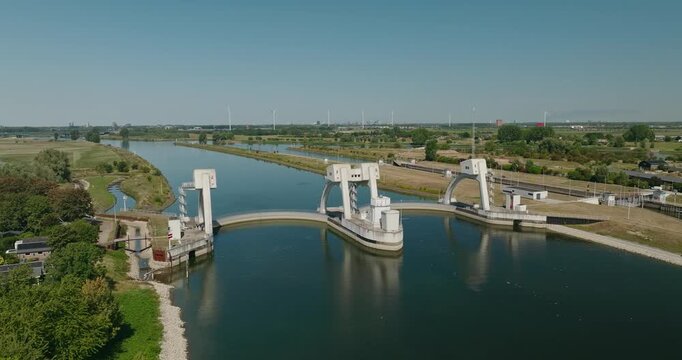 Spectacular aerial view of Hagestein Weir on the Dutch Lek River, a major water control structure regulating river water levels and flow in the Netherlands.