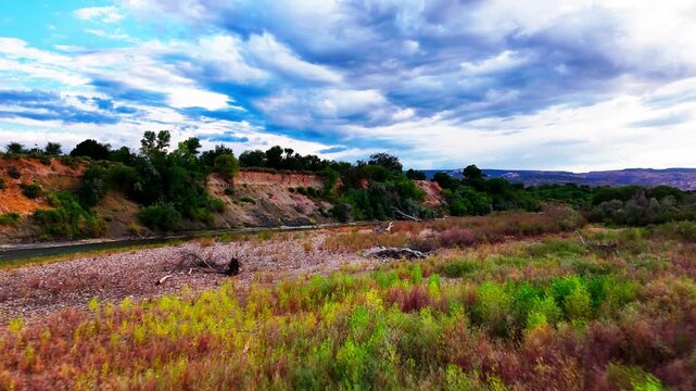 Flyover of the Colorado River during late summer in a bad draught season, located near Las Colonias Park in Grand Junction, Colorado.