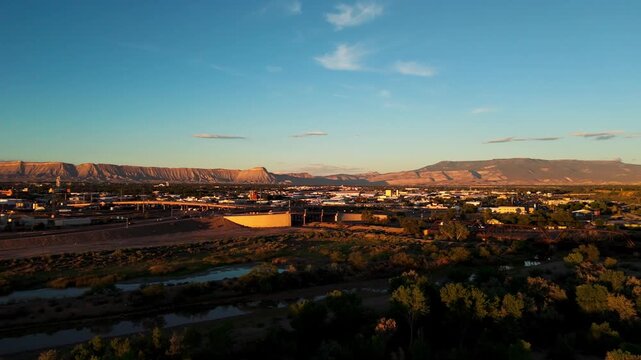 Slow pan of the Grand Valley, Grand Mesa, Mt. Garfield and the Bookcliffs. Filmed at sunset in the late summer.