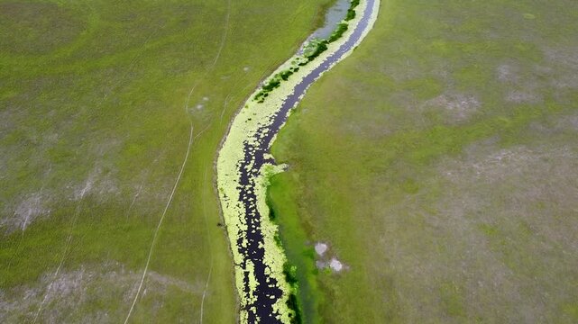 Aerial view reverse over plains landscape and river at Nino Konis Santana National Park, Lautem District, Timor-Leste, Southeast Asia