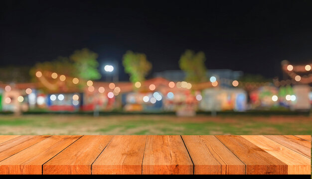 Empty wooden table top with blurred festive bokeh lights at night market