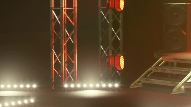 The scene shows a stage area prepared for a live event. Bright lights are set up, and various equipment is arranged in the background. The atmosphere suggests readiness for performance.